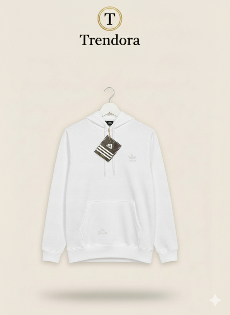 White hoodie with Adidas tag on a beige background, featuring the Trendora brand.