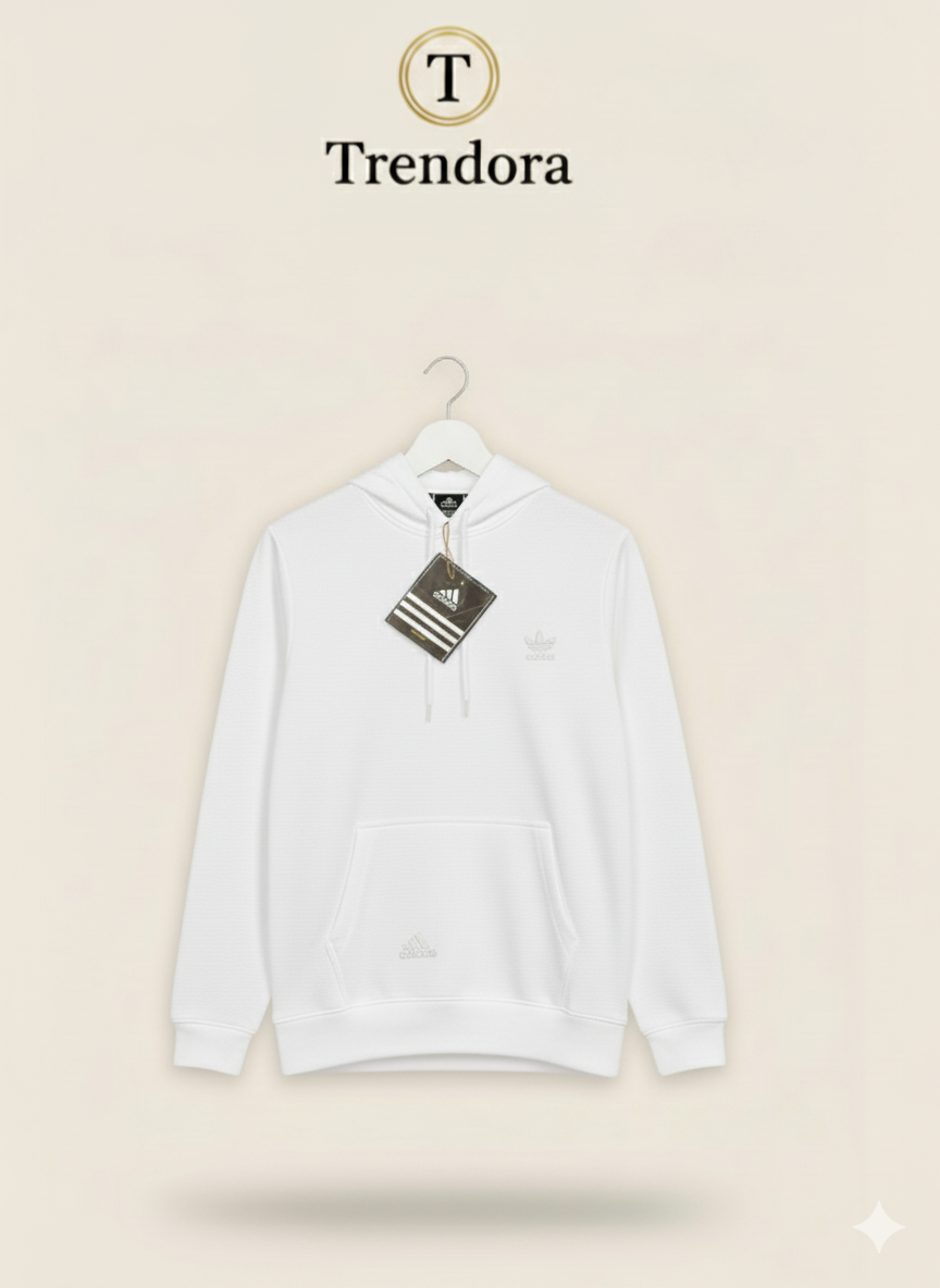 White hoodie with Adidas tag on a beige background, featuring the Trendora brand.